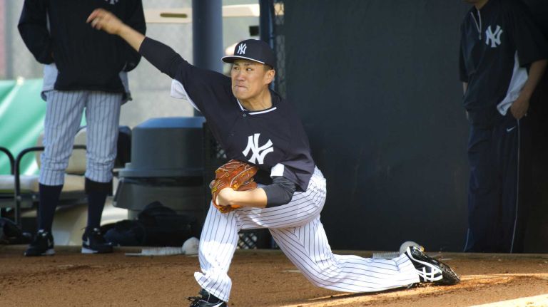 Yankees' Masahiro Tanaka works out in the bullpen at Steinbrenner Field on the morning of Feb. 15, 2014.