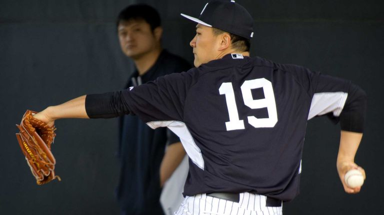 Yankees' Masahiro Tanaka works out at Steinbrenner Field in Tampa, Fla. on the morning of Feb. 15, 2014.