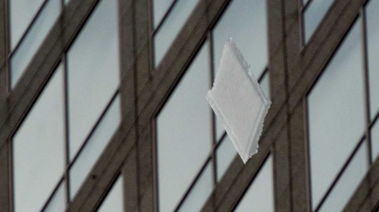 Photo of the day 15 FEBRUARY 19, 2014: Streets around One World Trade Center were closed as giant chunks of ice (this piece was about six-by-four feet) fell from nearby buildings.