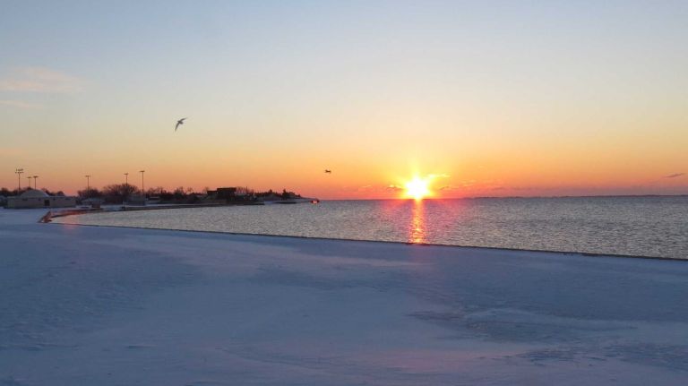 Photo of the day 16 FEBRUARY 16, 2014: You can escape the city for the weekend, but you can't hide from the snow. The sun rises over the Great South Bay off Long Island.