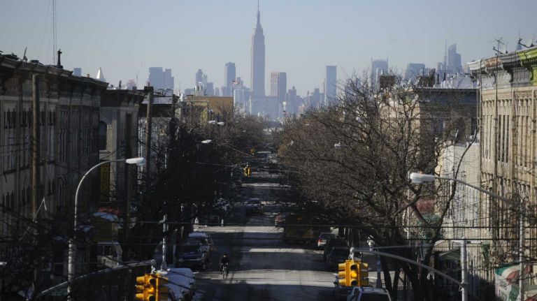 The view of Manhattan from Seneca Avenue subway station.