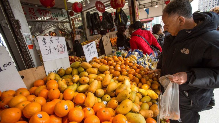 Fresh produce grocers and Asian restaurants line Main Street in Flushing. 