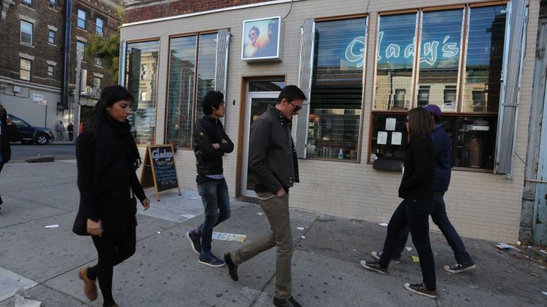 Pedestrians pass by Glady's on Franklin Avenue. (Oct. 25, 2013)