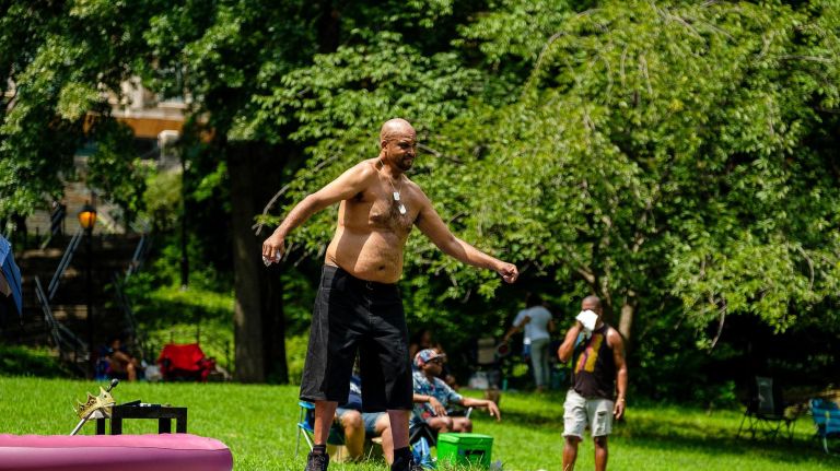 Sundae Sermon brings Harlem out to dance at St. Nicholas Park 16 A man dances to music by DJ Stormin Norman.
