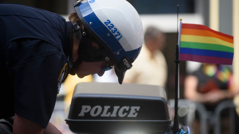 Pride parade NYC: Photos of the 2018 march through Manhattan 64 A police officer at the start of the parade prepares his motorcycle with a Pride flag in tact.
