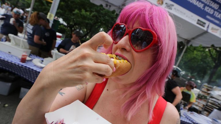 Holly Holbrook-Gross enjoys her kielbasa.