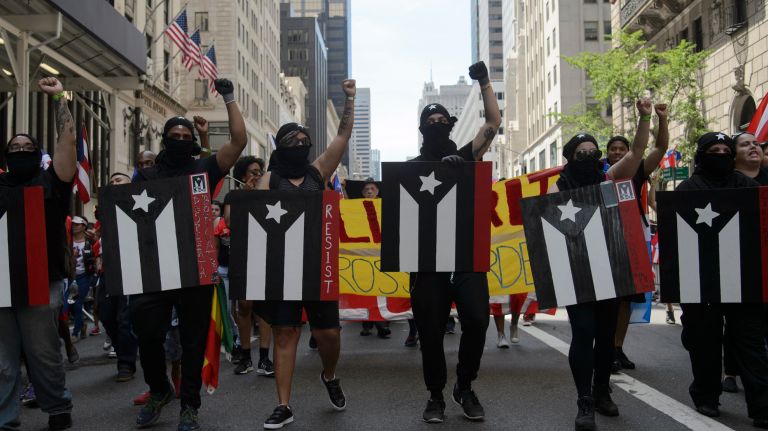 Supporters of Oscar López Rivera, the leader of the FALN separatist group that pushed for Puerto Rico's independence and was behind a series of bombings in New York and other U.S. cities in the 1970s and 1980s, march in the 60th annual Puerto Rican Day Parade on Sunday, June 11, 2017.