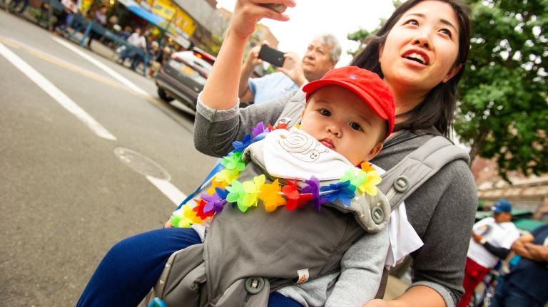 Queens Pride Parade injects color into an otherwise cloudy day 17 Thanks to Cindy Mandej, her son Mathew Mandej, 9 months, has a front-row view of the 26th annual Pride Parade and Festival.