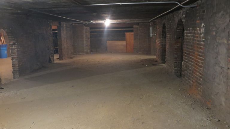 The church aided escaped slaves from the South. They'd come mostly by water and always under the cover of darkness, staying only one or two nights in this dark basement with low ceilings. A tour of the church always includes a trip down the metal stairs and under the archways to see the space.