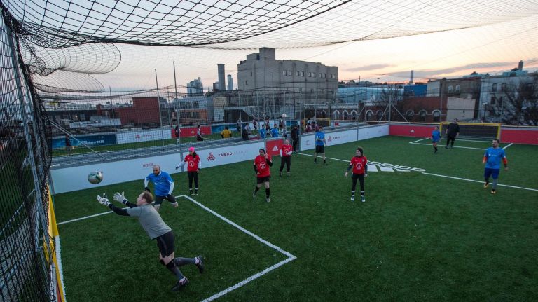 The rooftop soccer field was previously used as a parking lot for a car dealership.