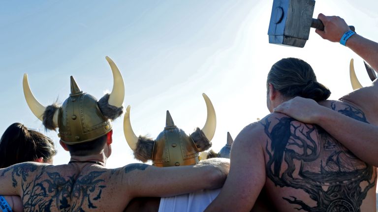 Swimmers prepare to run into the ocean during the Coney Island Polar Bear Club's New Year's Day Swim on Jan. 1, 2017.