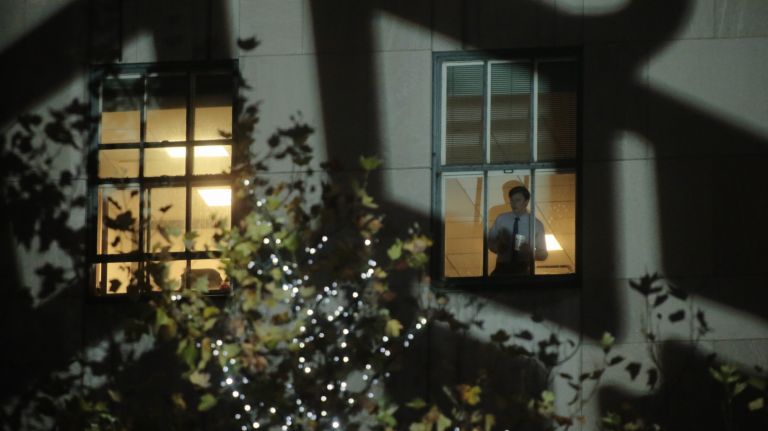 A man watches the Rockefeller Christmas tree concert at Rockafeller Center on Wednesday, Nov. 30, 2016