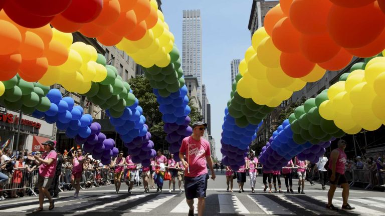 NYC Pride March 2016: See photos of the annual march to commemorate the Stonewall riots 103 Participants march with balloons in the New York City Pride March on Fifth Avenue in Manhattan on Sunday, June 26, 2016. This year's Pride parade pays tribute to the 49 killed in the shooting at a gay nightclub in Orlando, Florida, two weeks ago on June 12.