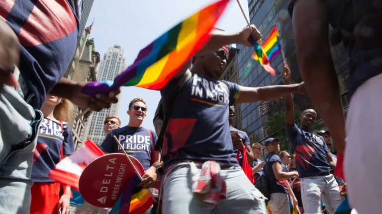 NYC Pride March 2016: See photos of the annual march to commemorate the Stonewall riots 117 Louis Terry of Astoria dances with fellow Delta Air Lines paradegoers during the 46th annual New York City Pride March on Fifth Avenue in Manhattan on Sunday, June 26, 2016. This year's Pride parade pays tribute to the 49 killed in the shooting at a gay nightclub in Orlando, Florida, two weeks ago on June 12.