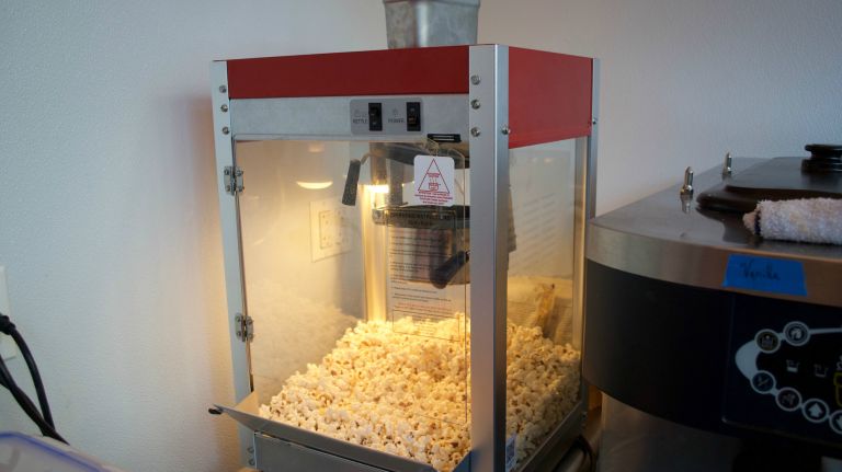 You can just get a bag of fresh popcorn or cotton candy straight from the in-store machines ($3).