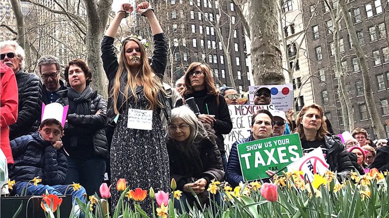 Demonstrators gather at Bryant Park on April 15, 2017, for the NYC Tax March, demanding President Donald Trump show his tax records.