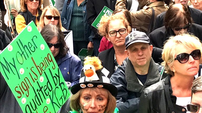 Thousands march in midtown Manhattan on April 15, 2017, demanding that President Donald Trump reveal his tax records. Many said they want to know who he represents.