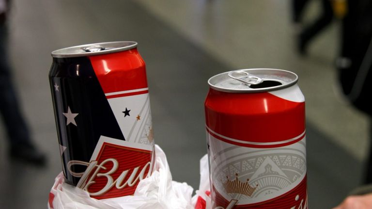 Alcohol will not be permitted on MTA trains on Friday, March 17, 2017, the agency said. Above, two people drink beer at Penn Station in Manhattan.