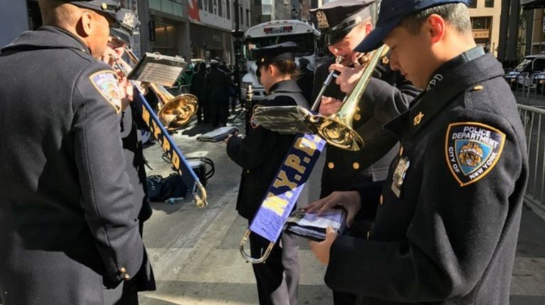 Members of the NYPD get ready as the St. Patrick's Day parade steps off Fifth Avenue in Manhattan, Friday, March 17, 2017.