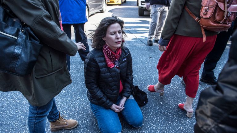 A protester engages in civil disobedience in Manhattan's Columbus Circle during the A Day Without a Woman rally on International Women's Day on March 8, 2017.