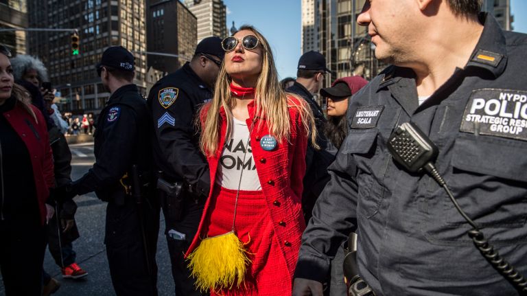 A protester is arrested in Manhattan's Columbus Circle during the A Day Without a Woman rally on International Women's Day on March 8, 2017.