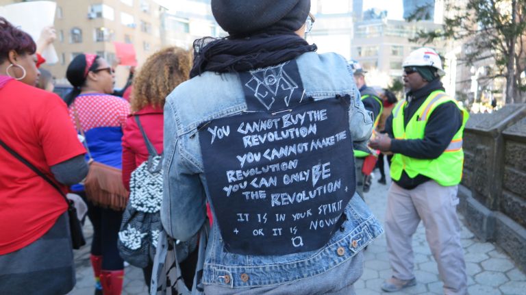 A woman participates in the A Day Without a Woman rally in Manhattan on Wednesday, March 8, 2017.