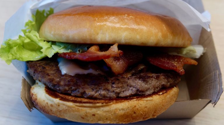 French-inspired McDonald's debuts in NYC 15 The Maple Bacon Dijon burger features maple seasoning, bacon, white cheddar, Dijon mustard and grilled onions.