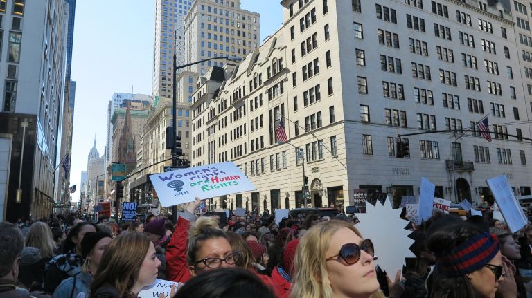 Crowds gather at the A Day Without a Woman rally held near 59th Street and Fifth Avenue in Manhattan on Wednesday, March 8, 2017.