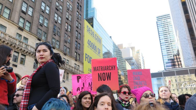 Crowds gather at the A Day Without a Woman rally held near 59th Street and Fifth Avenue in Manhattan on Wednesday, March 8, 2017.
