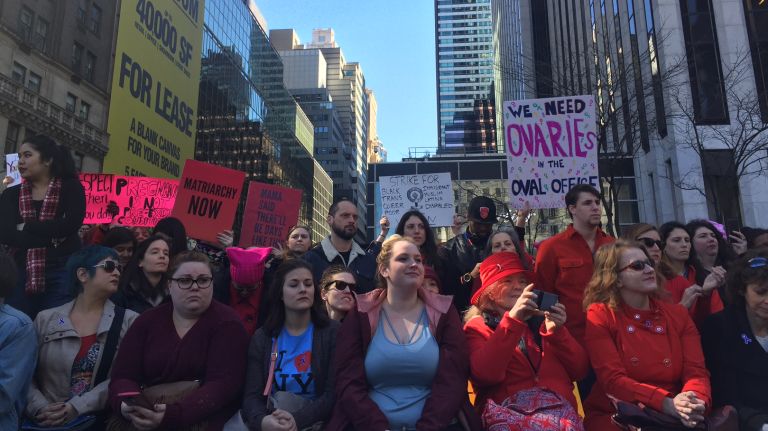 Crowds gather at the A Day Without a Woman rally held near 59th Street and Fifth Avenue in Manhattan on Wednesday, March 8, 2017. 