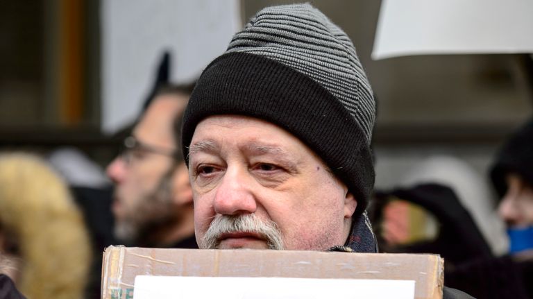 A protester joins the rally outside the New York Times building in midtown Manhattan during the March for a Free Press on Feb. 26, 2017.