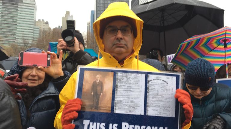 A demonstrator holds a sign during a rally in Battery Park on Feb. 12, 2017.