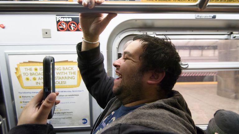 Passengers ride a northbound Q train during the first day of service on the Second Avenue subway in Sunday, Jan. 1, 2017.
