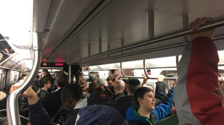 Commuters packed into a northbound Q train during the first day of service on the Second Avenue subway on Sunday, Jan. 1, 2017.