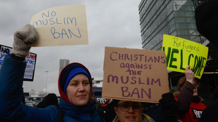 Protesters at Kennedy Airport. President Donald Trump said Christian refugees to the United States will be given priority.