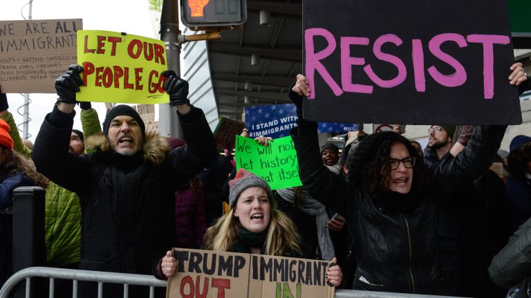 Protesters at Kennedy Airport decry Trump's executive order.