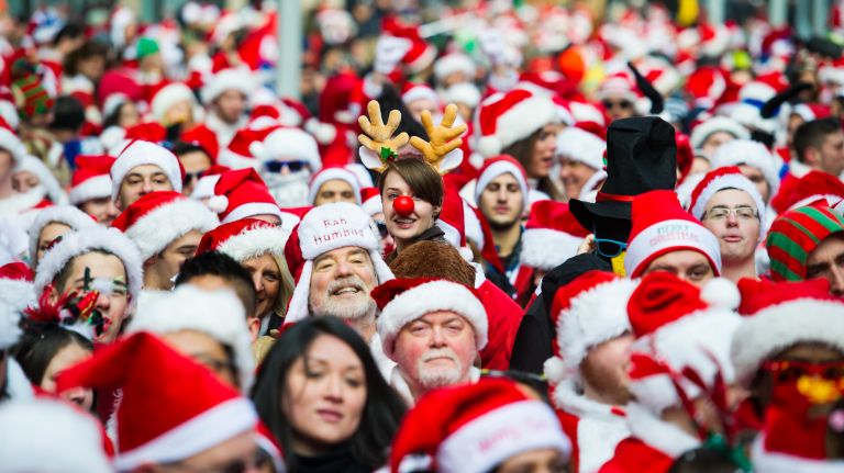 Rudolph and a herd of Santas gather for SantaCon on East 23rd Street and Broadway in Manhattan on Dec. 10, 2016.