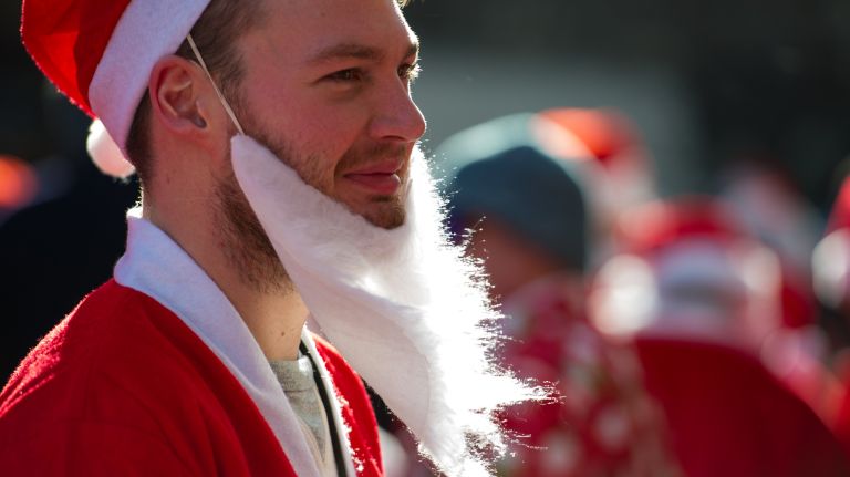 A man dressed as Santa waits for the start of SantaCon on East 23rd Street and Broadway in Manhattan on Dec. 10, 2016.
