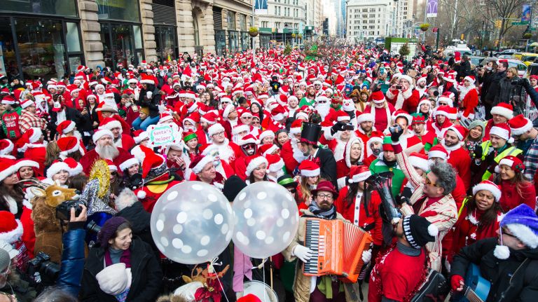People dressed as Santas gather for the start of SantaCon on East 23rd Street and Broadway in Manhattan on Dec. 10, 2016.