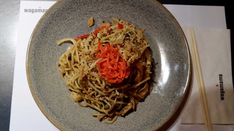These tender soba noodles are served with chicken and prawns, egg, peppers, bean sprouts, white onion and scallions -- and garnished with crispy fried shallots, sesame seeds and pickled ginger that brightens things up in terms of both taste and appearance.