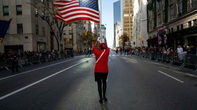 A flag-bearer with Les Cadets Lafayette marches up Fifth Avenue during the Veterans Day Parade on Friday, Nov. 11, 2016.