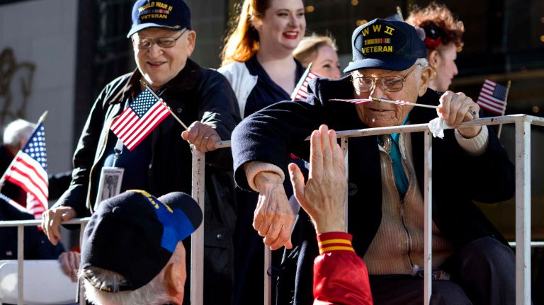 World War II veterans ride a float up Fifth Avenue during the Veterans Day Parade on Friday, Nov. 11, 2016.