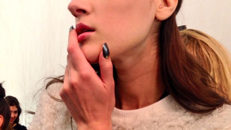 Backstage at New York Fashion Week 11 A model strikes a pose before the Badgley Mischka show at New York Fashion Week.