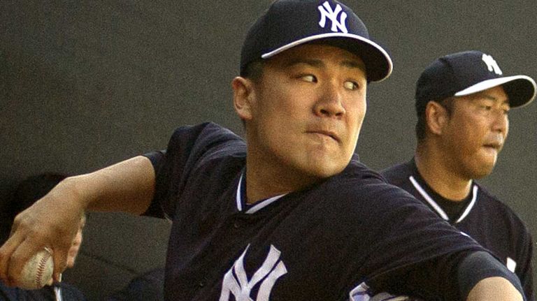 Yankees pitchers Masahiro Tanaka and Hiroki Kuroda throw in the bullpen at Steinbrenner Field on the morning of Tuesday, Feb. 18, 2014.