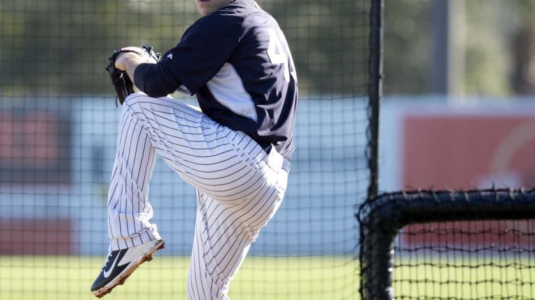 Yankees pitcher David Phelps works out at Steinbrenner Field on Feb. 17, 2014.