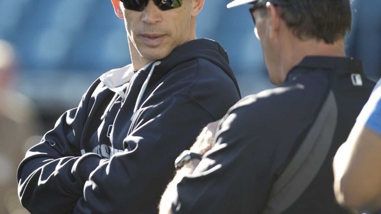 Yankees manager Joe Girardi watches batting practice at Steinbrenner Field on the morning of Tuesday, Feb. 18, 2014.