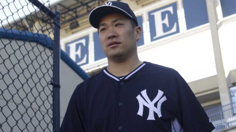 Yankees pitcher Masahiro Tanaka takes the field to work out at Steinbrenner Field on Feb. 17, 2014.