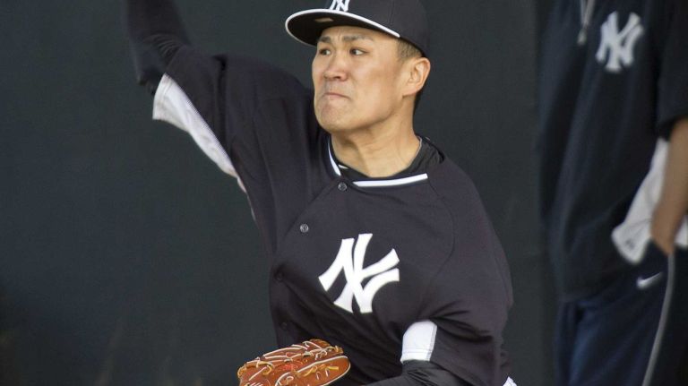 Yankees' Masahiro Tanaka works out in the bullpen at Steinbrenner Field on the morning of Feb. 15, 2014.