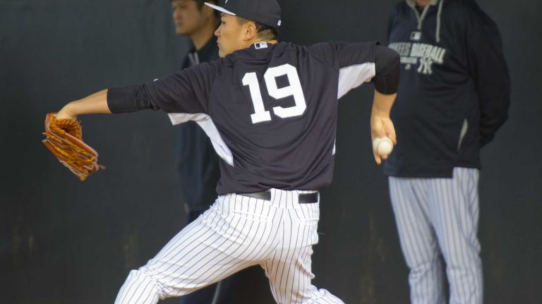 Yankees' Masahiro Tanaka works out at Steinbrenner Field in Tampa, Fla. on the morning of Feb. 15, 2014.