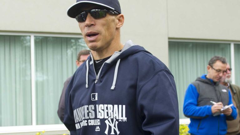Joe Girardi takes the field at Steinbrenner Field on Feb. 15, 2014.